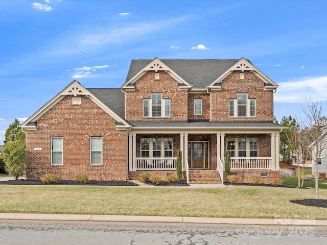 craftsman house with covered porch and a front yard