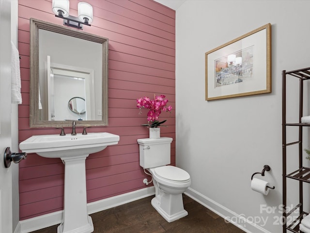 bathroom featuring toilet and hardwood / wood-style floors