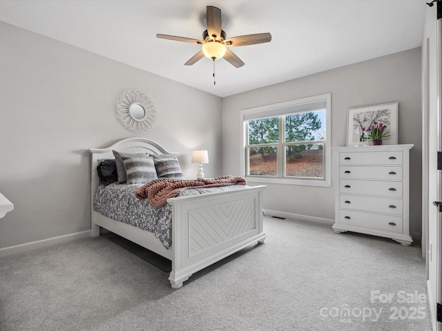 bedroom with ceiling fan and light colored carpet