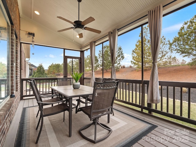 sunroom with vaulted ceiling and ceiling fan