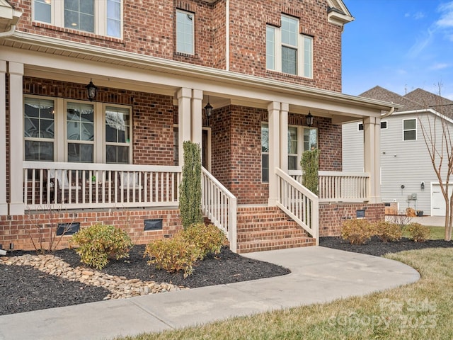 view of exterior entry featuring a porch