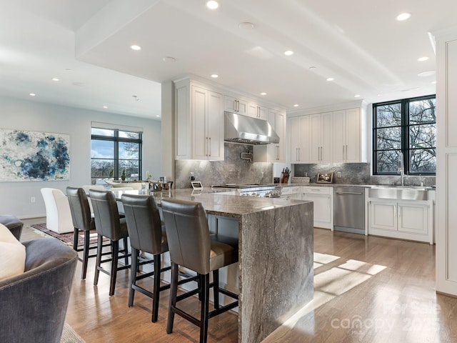 kitchen featuring white cabinetry, sink, and dishwasher