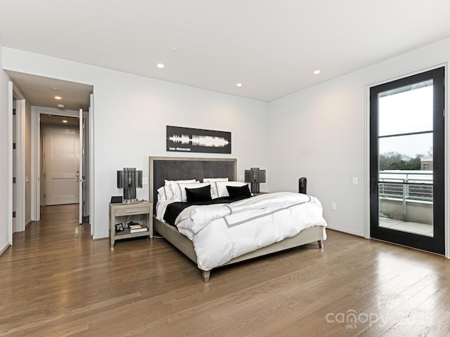 bedroom featuring access to outside and wood-type flooring