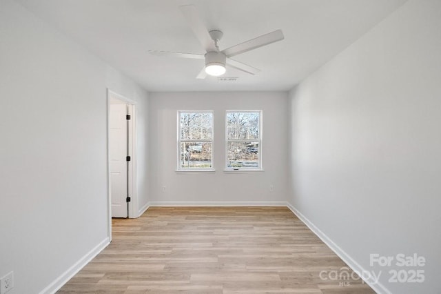 empty room with light hardwood / wood-style floors and ceiling fan