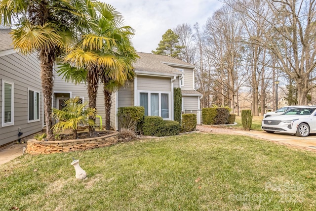 view of home's exterior featuring a lawn