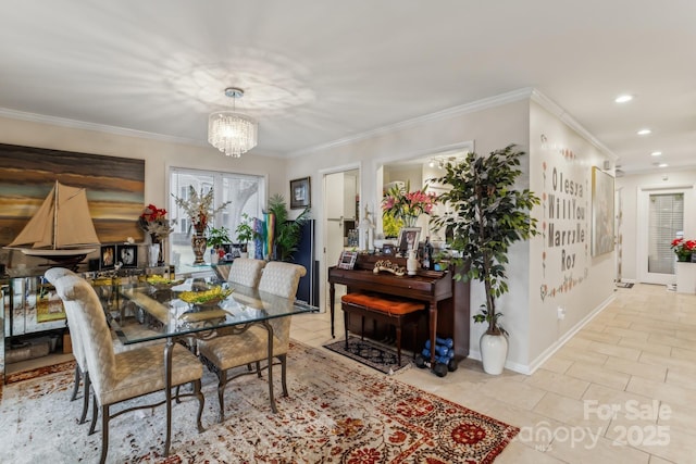 dining area with light tile patterned flooring, ornamental molding, and an inviting chandelier