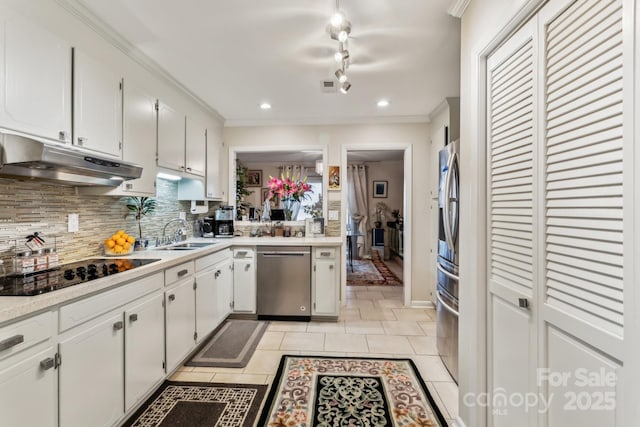 kitchen featuring light tile patterned flooring, sink, white cabinets, backsplash, and stainless steel appliances