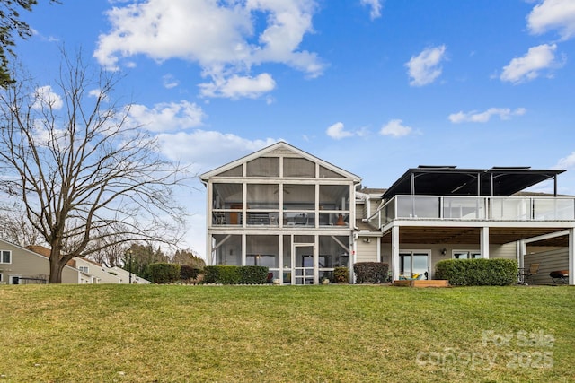 back of property featuring a yard