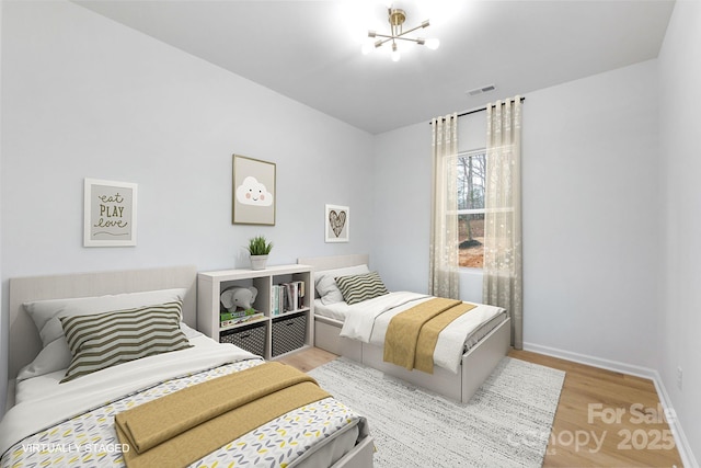 bedroom with light hardwood / wood-style floors