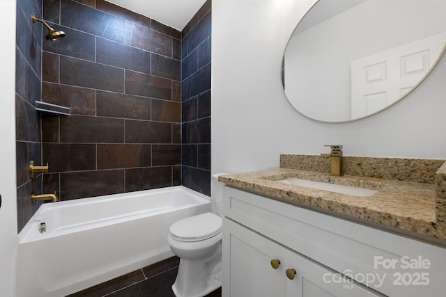 full bathroom with vanity, toilet, tiled shower / bath, and tile patterned floors