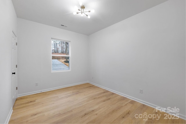 unfurnished room featuring light hardwood / wood-style floors