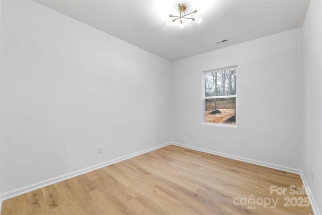 unfurnished room with hardwood / wood-style floors