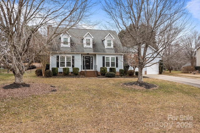 cape cod-style house with a front yard