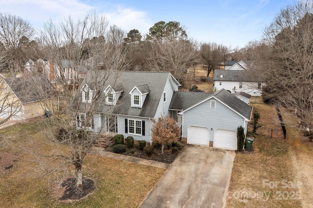 cape cod-style house with a garage