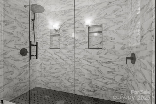 bathroom featuring an enclosed shower