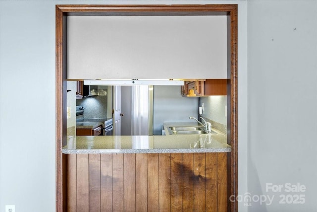 kitchen with sink and electric range