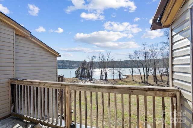wooden deck with a water view