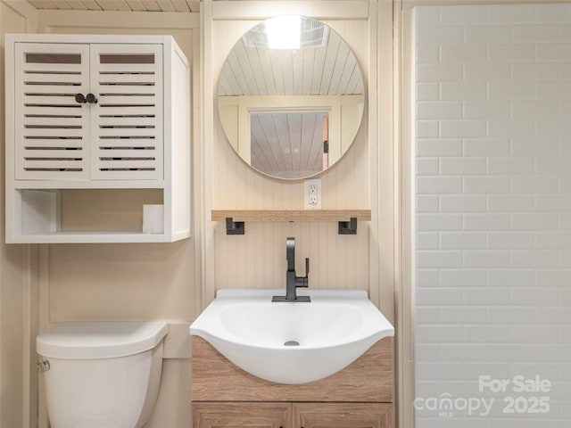 bathroom with vanity and toilet