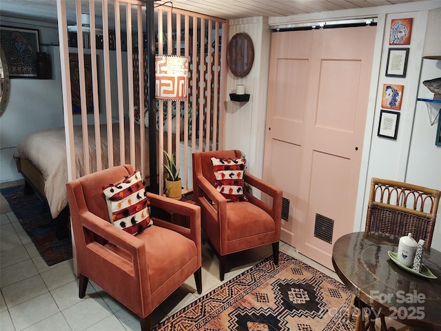 living area featuring light tile patterned flooring