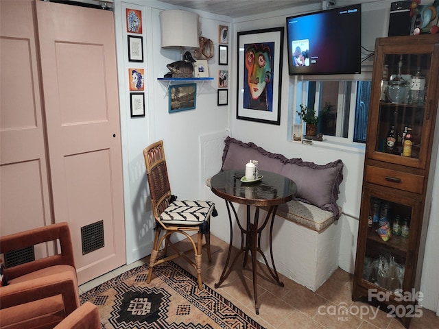 sitting room featuring light tile patterned floors