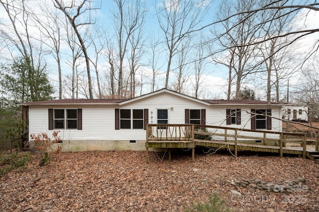 rear view of house with a wooden deck