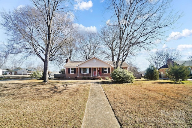 view of front of home featuring covered porch and a front lawn