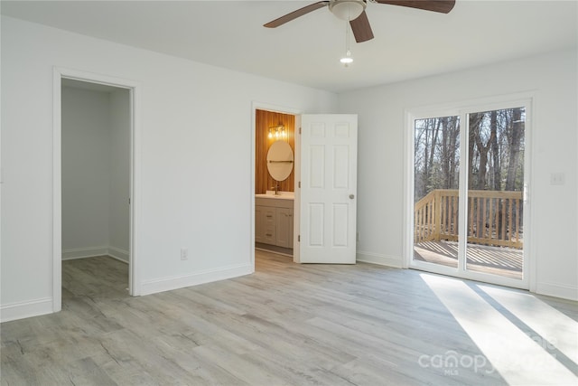 spare room with light hardwood / wood-style floors and ceiling fan