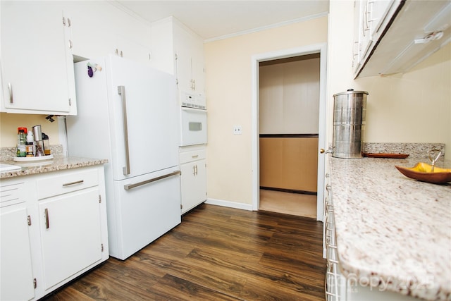 kitchen featuring crown molding, white appliances, white cabinets, and dark wood finished floors