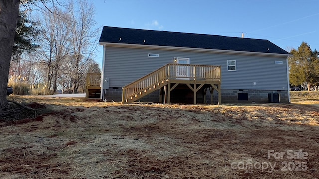 rear view of house featuring a deck, central AC, crawl space, and stairway