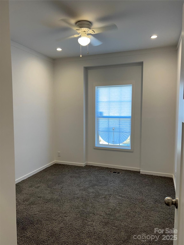 unfurnished room with recessed lighting, visible vents, dark carpet, a ceiling fan, and baseboards