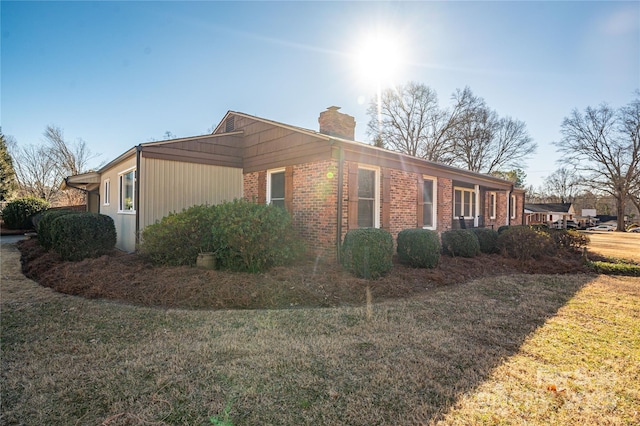 view of property exterior featuring a lawn