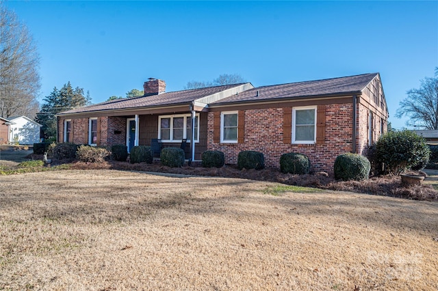 ranch-style house with a front lawn