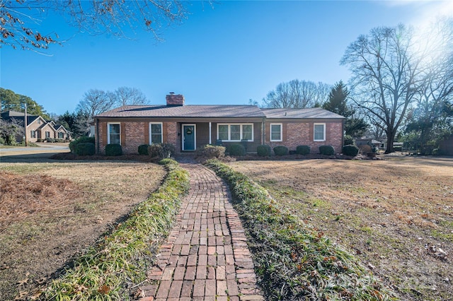 ranch-style house with a front yard