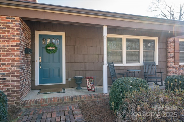 property entrance with covered porch