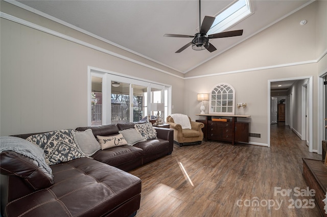 living room with ceiling fan, dark hardwood / wood-style floors, high vaulted ceiling, and ornamental molding