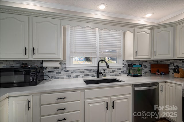 kitchen with dishwashing machine, white cabinets, a textured ceiling, tasteful backsplash, and sink