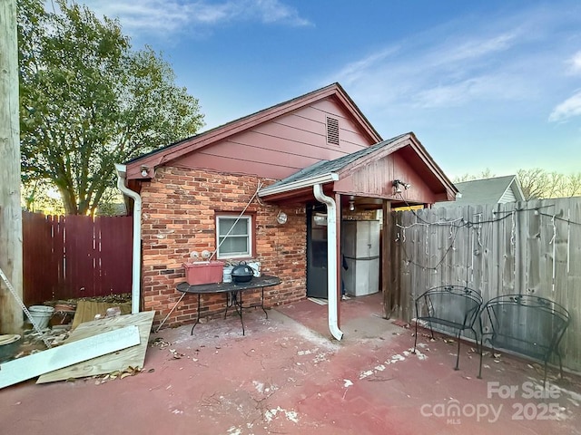 view of patio featuring fence