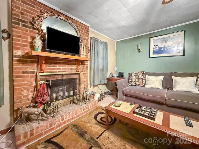 living room featuring ornamental molding and a brick fireplace