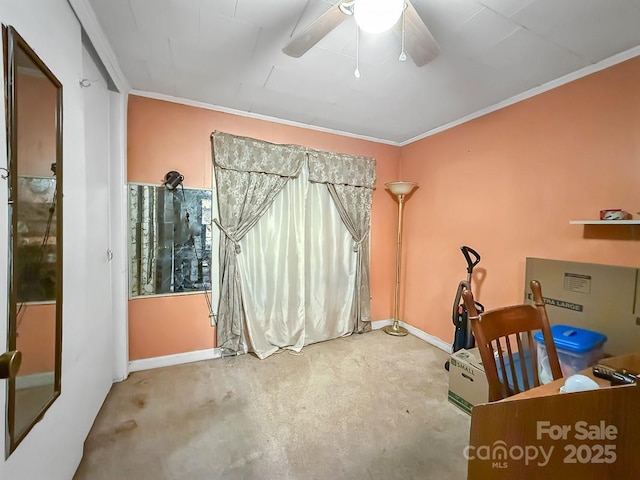 interior space with crown molding, baseboards, and a ceiling fan