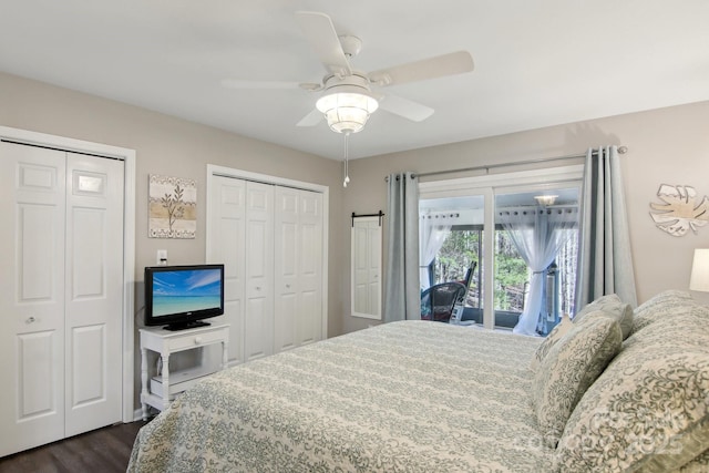 bedroom featuring multiple closets, dark hardwood / wood-style floors, and ceiling fan