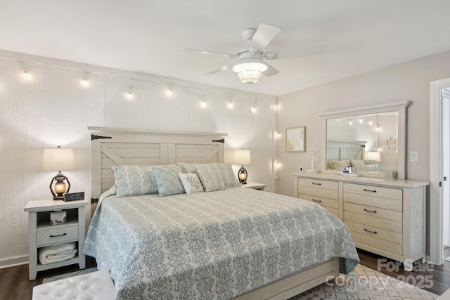 bedroom featuring dark hardwood / wood-style floors and ceiling fan