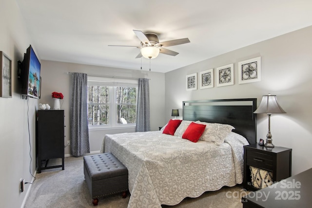 bedroom with ceiling fan and carpet