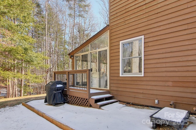 exterior space with a sunroom and a deck