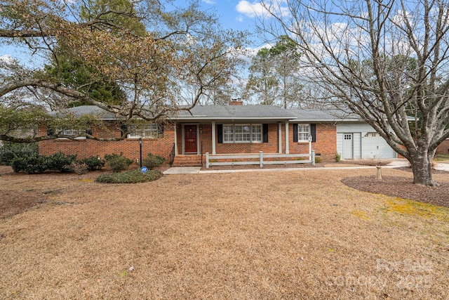 ranch-style house with a garage and a front lawn