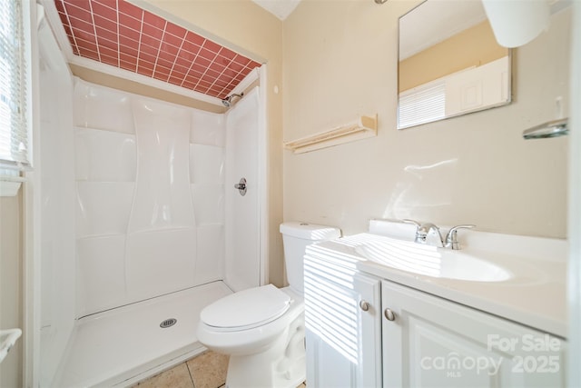 bathroom with walk in shower, vanity, toilet, and tile patterned flooring