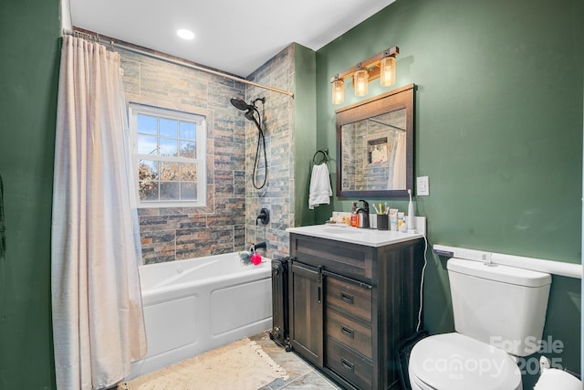 full bathroom with shower / bath combo with shower curtain, toilet, and vanity