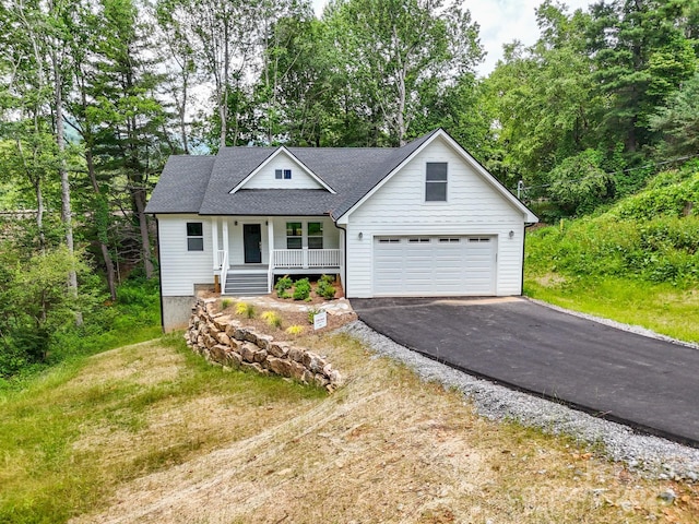 25 Amys Way, Black Mountain, NC 28711 - view of front of home featuring a porch, asphalt driveway, roof with shingles, and view of scattered trees