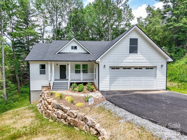 25 Amys Way, Black Mountain, NC 28711 - view of front facade with covered porch, a shingled roof, and asphalt driveway