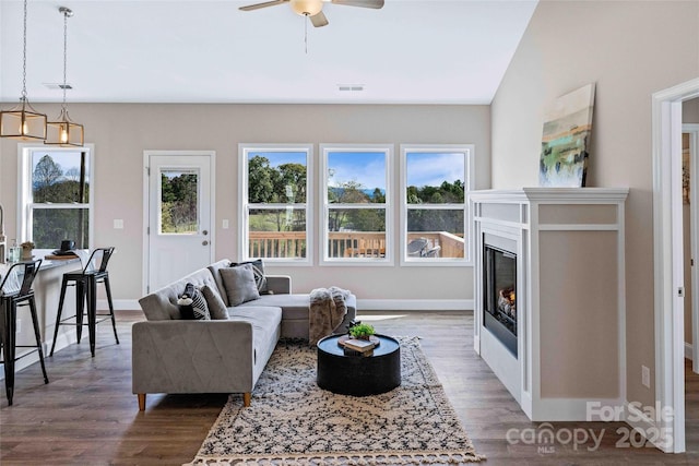 25 Amys Way, Black Mountain, NC 28711 - living area with wood finished floors, plenty of natural light, a ceiling fan, and a glass covered fireplace