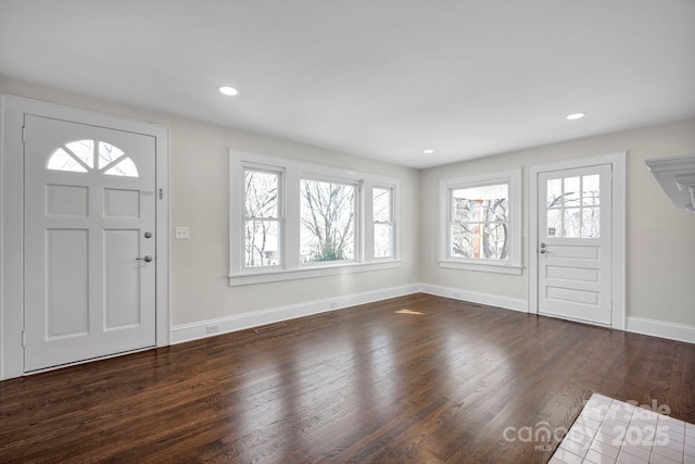 entryway with dark hardwood / wood-style floors